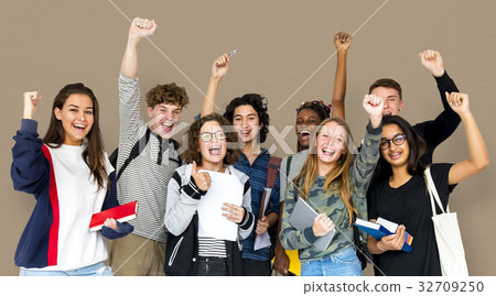 Group of students smiling and standing together 32709250
