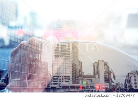 Double exposure on driving car and city Double exposure on driving car and city 32709477