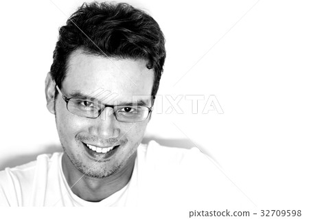 Asian man smiling and feeling happy Asian man smiling and feeling happy 32709598