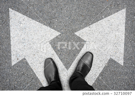 Businessman making decision at the crossroad Businessman making decision at the crossroad 32710097