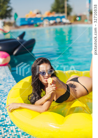 woman in bikini enjoying summer and tanning  32710838