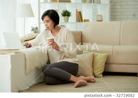 Young Asian Woman Enjoying Home Comforts 32719082