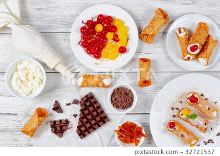 Sicilian Cannoli or cream horns on table Sicilian Cannoli or cream horns on table 32721537