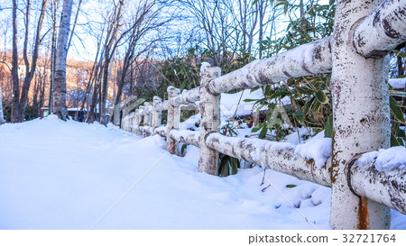 Wooden fence with heavy snow. Wooden fence with heavy snow. 32721764