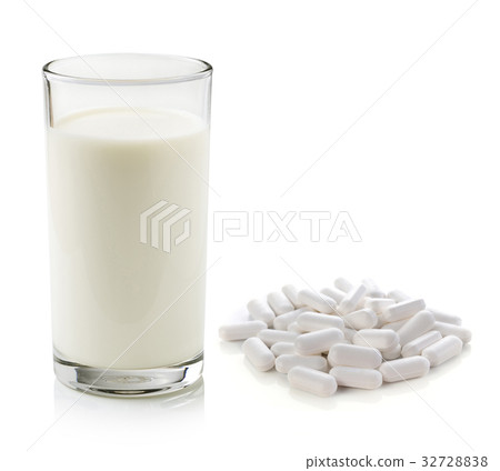 pill and glass of milk isolated on white pill and glass of milk isolated on white 32728838