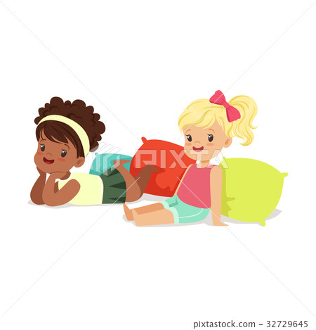 Two sweet little girls sitting and lying on the 32729645