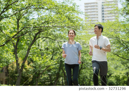 Jogging couple middle walking image Jogging couple middle walking image 32731296