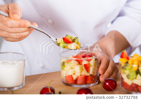 Chef with fruits 32732708
