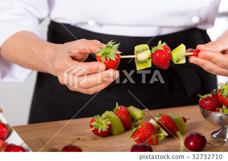 Chef with fruits 32732710
