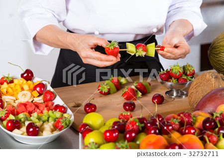 Chef with fruits 32732711