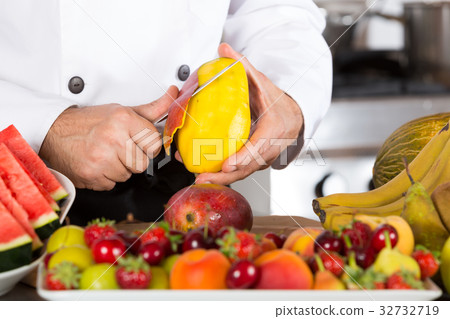 Chef with fruits 32732719