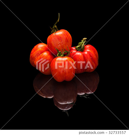 Pile tomato red-orange isolated on black Pile tomato red-orange isolated on black 32733557