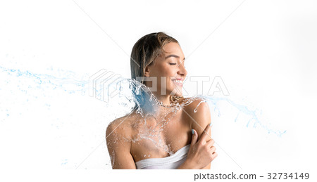 Happy girl enjoying water stream smiling 32734149