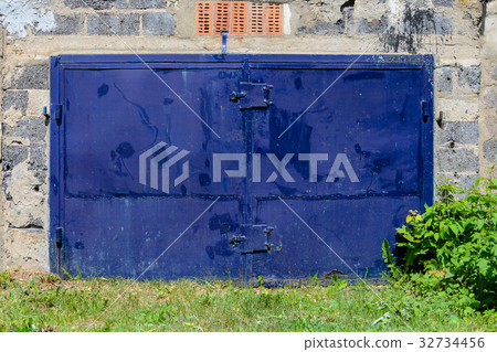 Old dark blue garage door 32734456