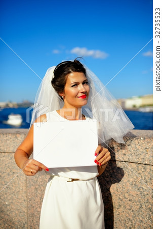Portrait of a bride with plate on quay Neva river, Saint-Petersburg 32735523