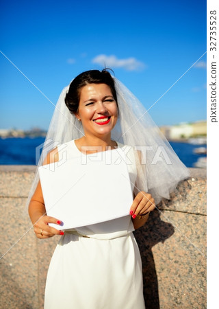Portrait of a bride with plate on quay Neva river, Saint-Petersburg 32735528
