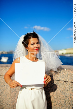 Portrait of a bride with plate on quay Neva river, Saint-Petersburg 32735531