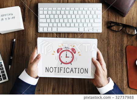Digital tablet alarm notification for important appointment Digital tablet alarm notification for important appointment 32737988