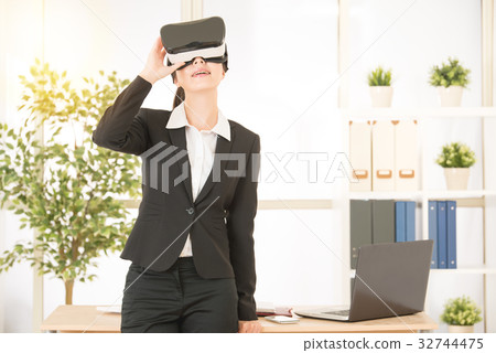 woman rest on working table with virtual reality 32744475