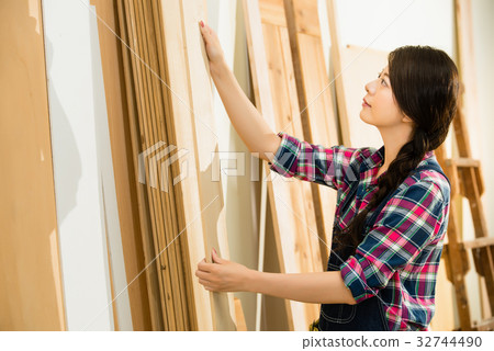 carpenter choosing best wood board 32744490