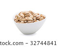 Pistachios in a white ceramics bowl 32744841