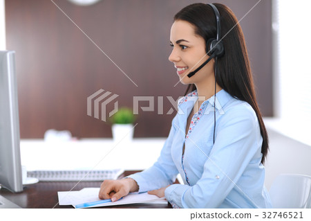 Young business woman or student girl with headset Young business woman or student girl with headset 32746521