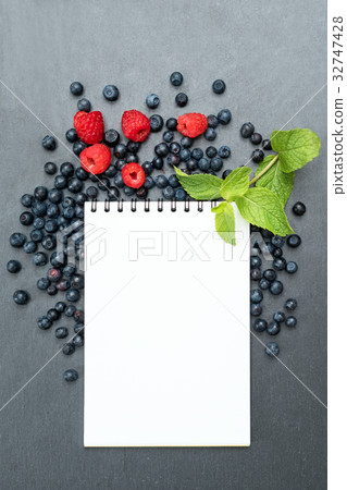 Blueberries, raspberries, mint and notepad for Blueberries, raspberries, mint and notepad for 32747428