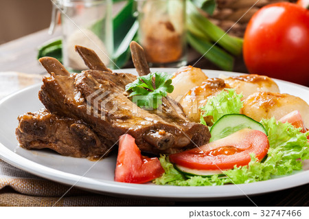 Pork spareribs served with silesian noodles 32747466