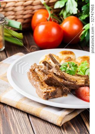 Pork spareribs served with silesian noodles Pork spareribs served with silesian noodles 32747468
