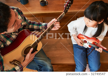 Parents playing the guitar Parents playing the guitar 32749547