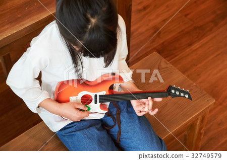 Girl playing guitar Girl playing guitar 32749579