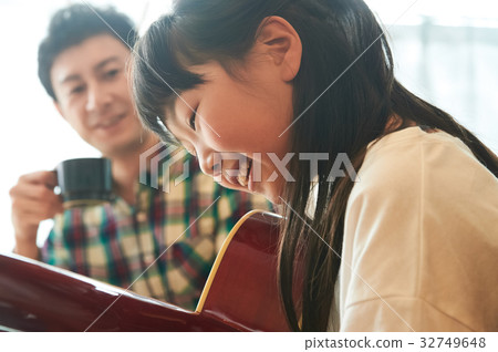 Parents playing the guitar Parents playing the guitar 32749648