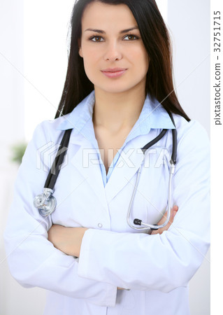 Brunette female doctor on the background of Brunette female doctor on the background of 32751715