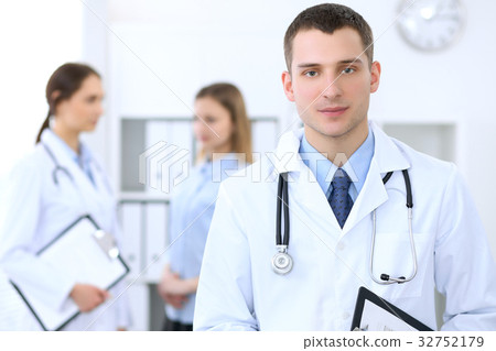 Friendly male doctor  on the background wit 32752179