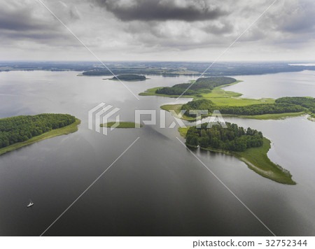 Aerial view of green islands on the lake in Poland Aerial view of green islands on the lake in Poland 32752344