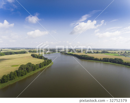 Aerial view of green islands on the lake in Poland Aerial view of green islands on the lake in Poland 32752379