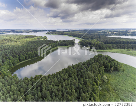 Aerial view of green islands on the lake in Poland Aerial view of green islands on the lake in Poland 32752392