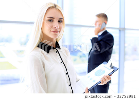 Happy modern business woman with financial report 32752981