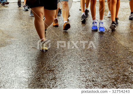 People walk along West 42nd Street in New York 32754243