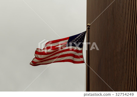 View of American flag on blue building background View of American flag on blue building background 32754249