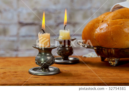 Shabbat with lighted candles, challah bread wine. Shabbat with lighted candles, challah bread wine. 32754381