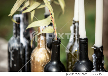 Burning candle in the vintage black bottle Burning candle in the vintage black bottle 32754530