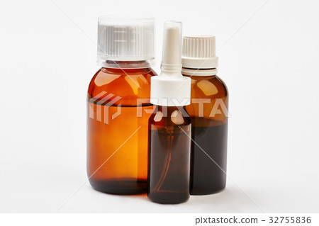 Liquid remedy in bottles. 32755836