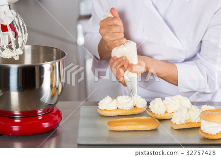 Pastry chef decorating Pastry chef decorating 32757428