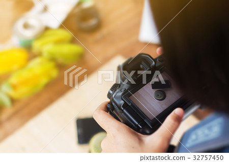 Close up of woman take photo by DSLR camera. Close up of woman take photo by DSLR camera. 32757450