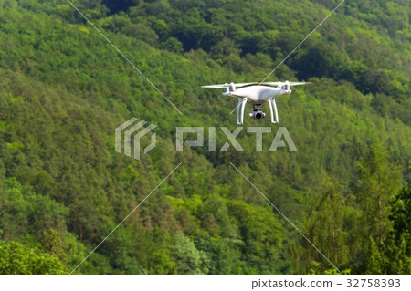 White drone quadrocopter with camera flying 32758393
