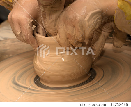 Beginner and teacher making clay bowl Beginner and teacher making clay bowl 32758486