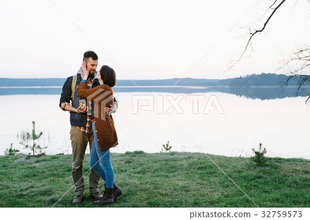 Young tourist couple at sunset sun 32759573