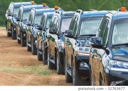 Cortege of black suvs 32763677