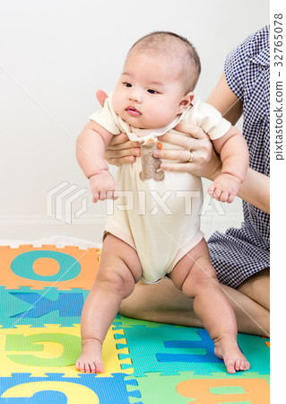 Portrait of a little adorable baby girl standing 32765078